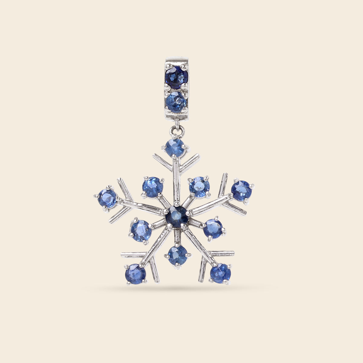 Sapphire gemstone snowflake pendant in sterling silver — side view