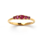 Gold ring with five vibrant ruby gemstones, elegant design for everyday wear
