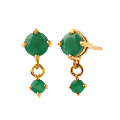 Close-up of emerald drop earrings in 925 sterling silver with gold finish, prong-set stones by Jewelry by Crimson