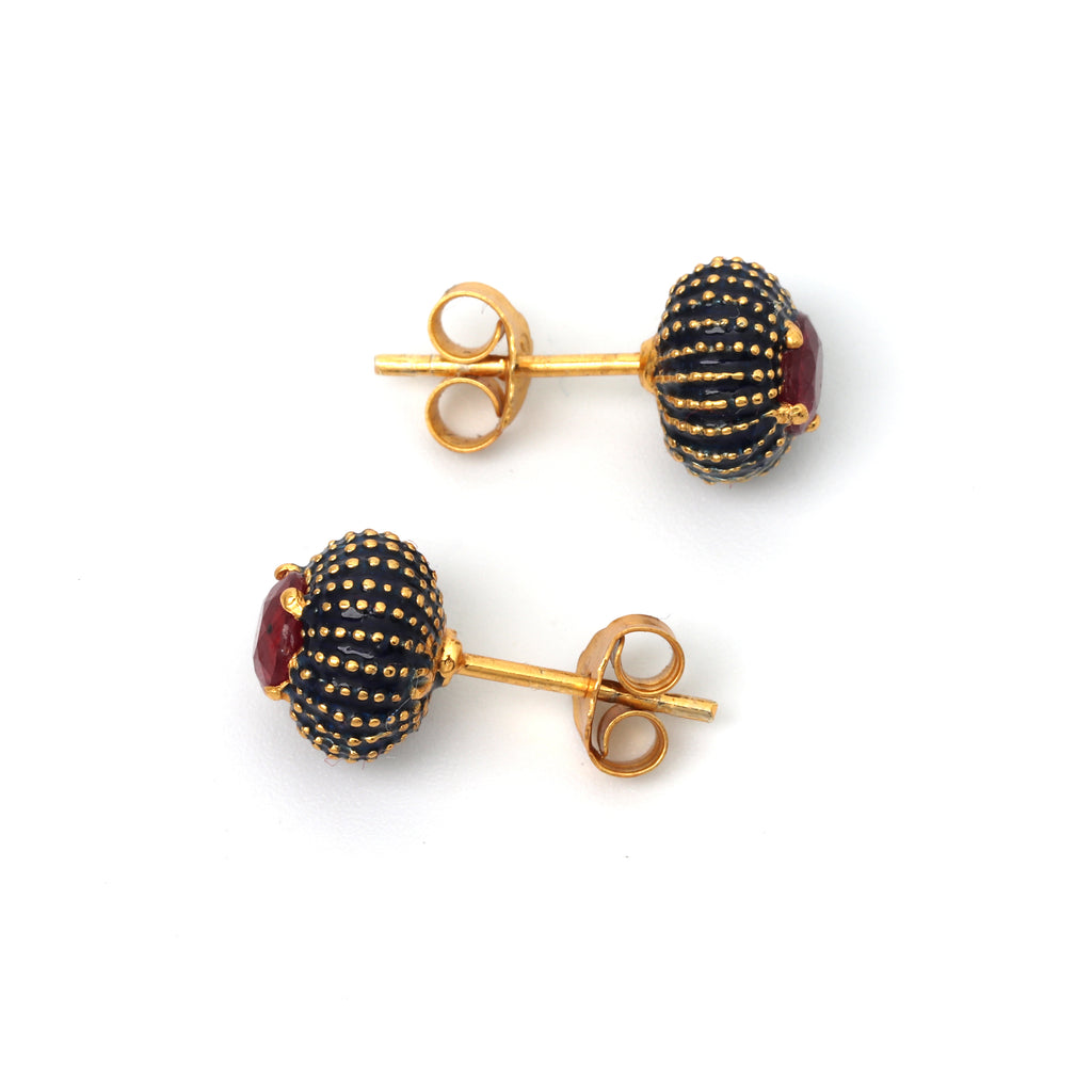 Elegant red ruby stud earrings with textured black enamel accents