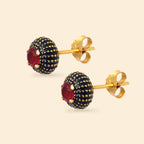 Gold stud earrings with navy enamel and red gemstone accents, handcrafted gemstone jewelry