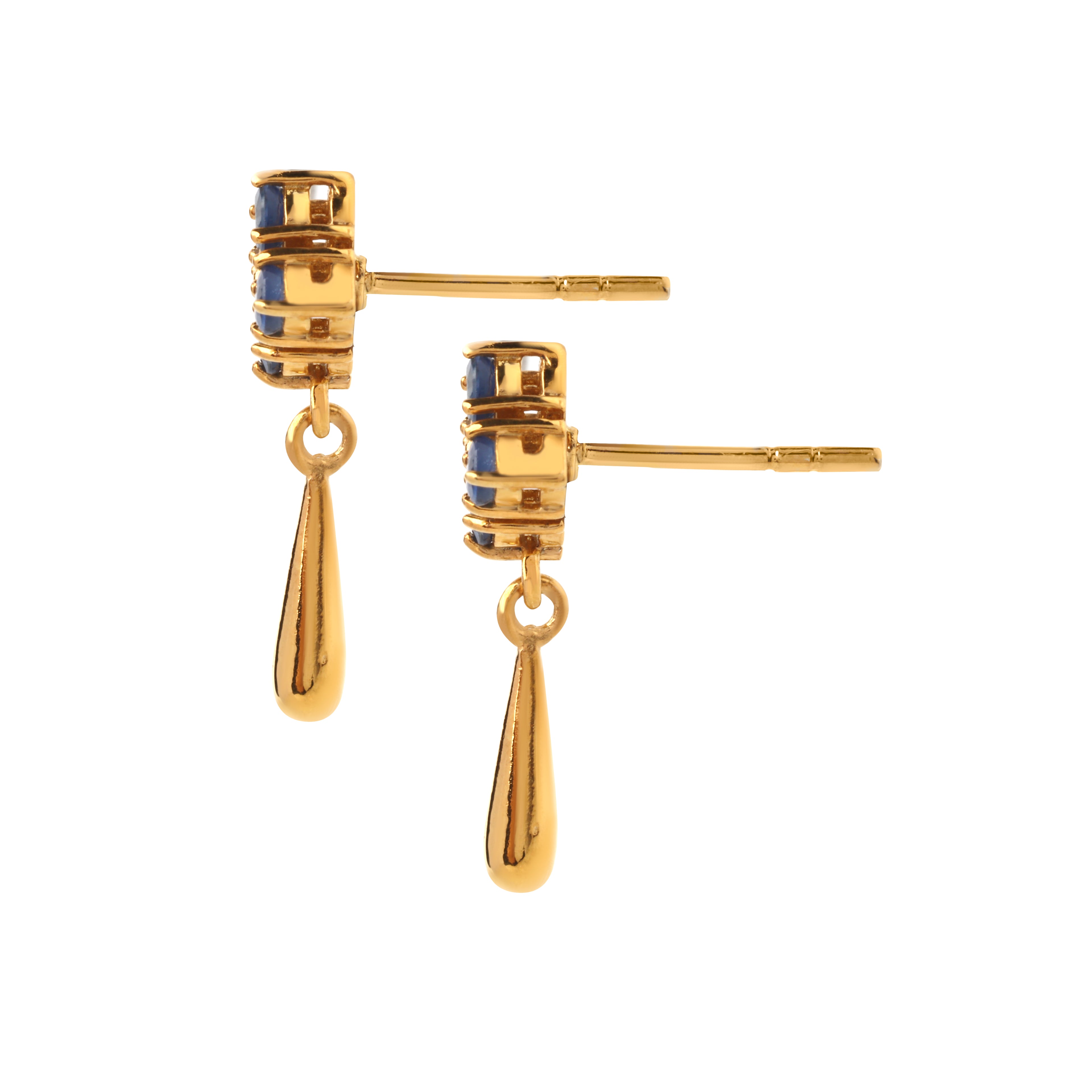 Side detail of sapphire silver earrings highlighting prong setting, polished gold finish, and drop design