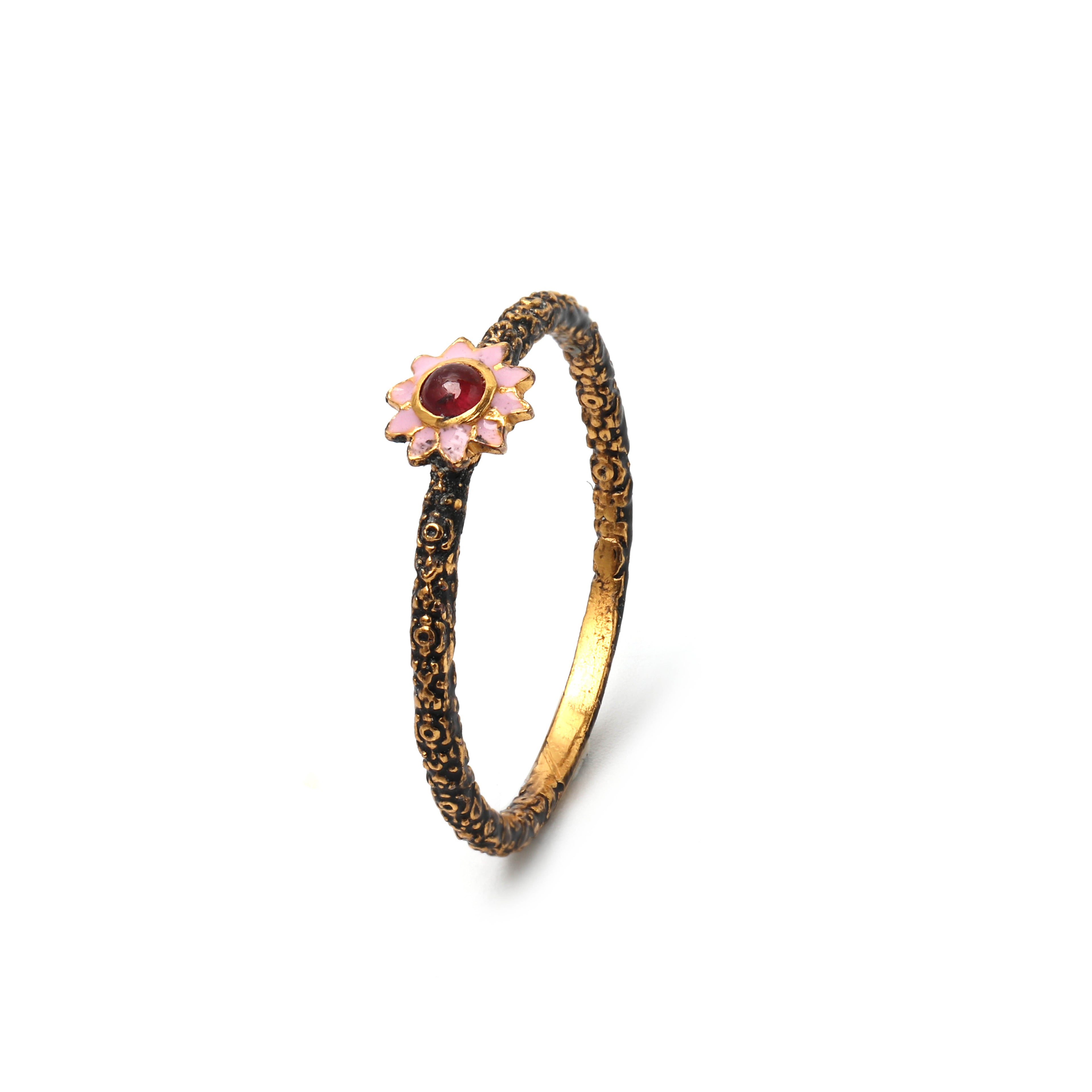 Handcrafted ruby flower ring featuring a vintage-inspired design