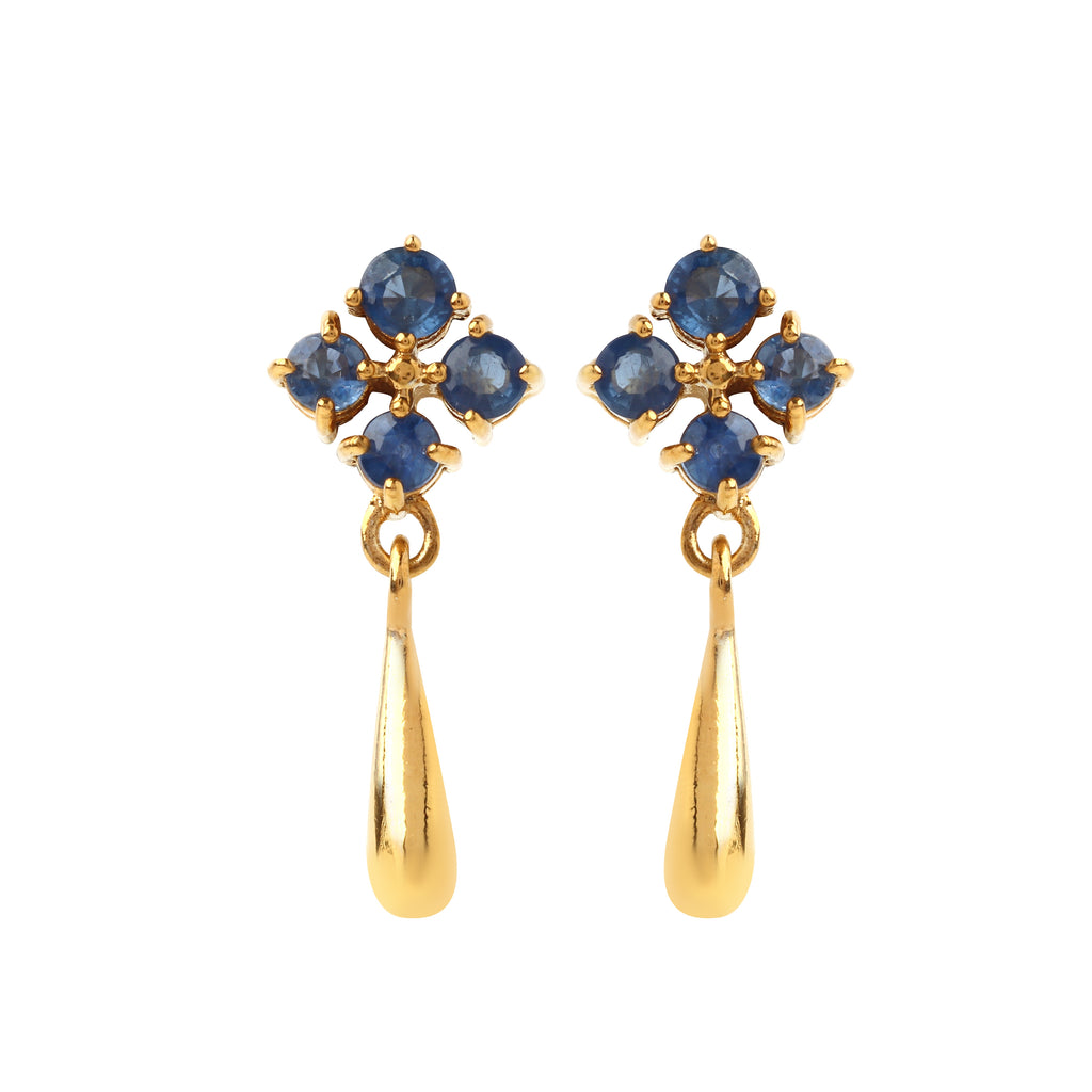 Close-up of 925 sterling silver sapphire drop earrings with prong-set blue sapphires and gold finish by Jewelry by Crimson