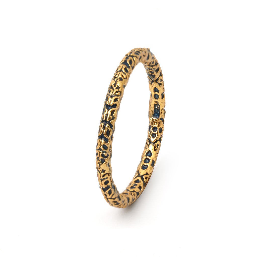 Minimalist organic texture ring with black and gold detailing