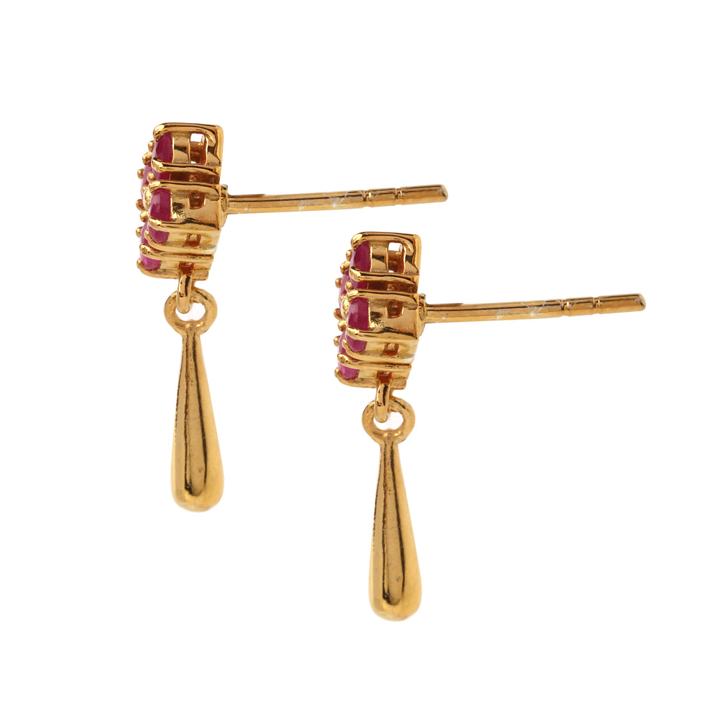 Side view of hypoallergenic ruby drop earrings showing prong-set gemstones and polished silver drop