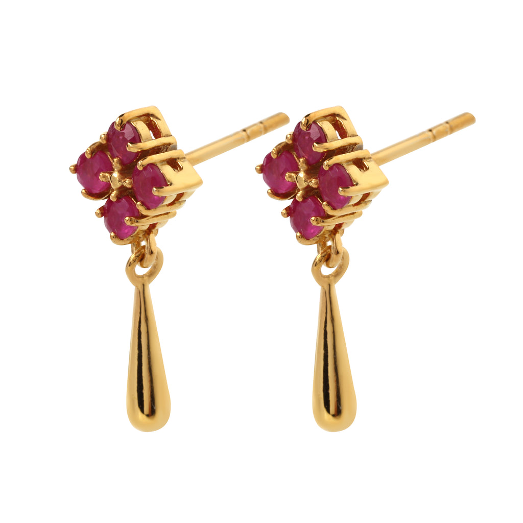 Side view of hypoallergenic ruby drop earrings showing prong-set gemstones and polished silver drop