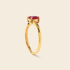Gold ring with oval ruby gemstone, elegant solitaire design