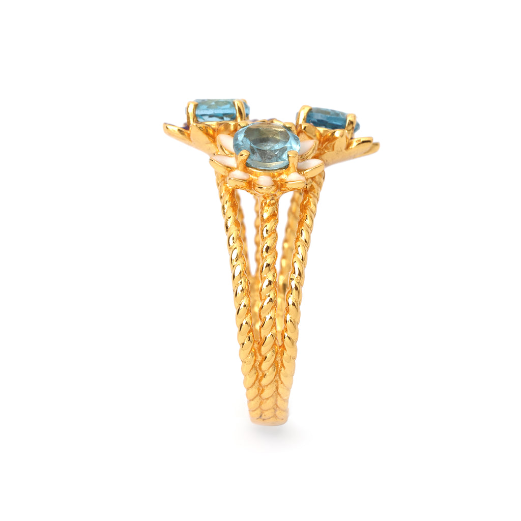 Handcrafted blue topaz ring with floral enamel details