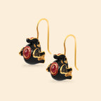 Black enamel elephant earrings with red gemstone accents and gold-tone hooks, handcrafted jewelry