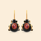 Black enamel and gold-tone earrings with oval red gemstone accents, handcrafted sterling silver jewelry
