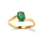 Elegant gold ring with oval emerald gemstone, handcrafted fine jewelry
