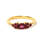 Elegant gold ring with oval red gemstone and smaller accents, handcrafted 925 sterling silver jewelry