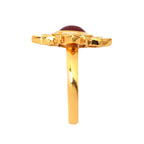 Gold ring with red cabochon gemstone and colorful enamel details, elegant handcrafted jewelry