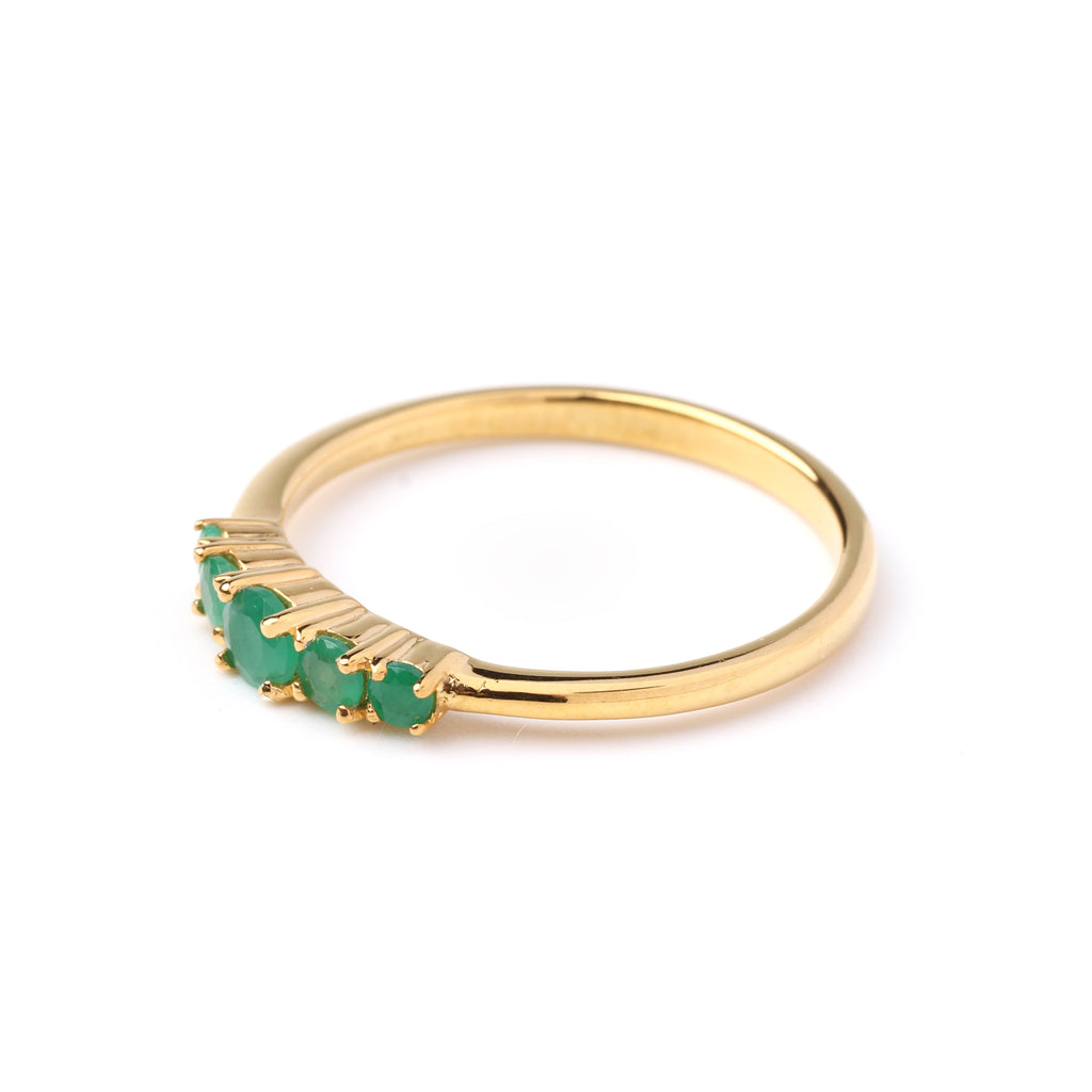 Prong-set emerald gemstones on 925 sterling silver ring with polished gold tone