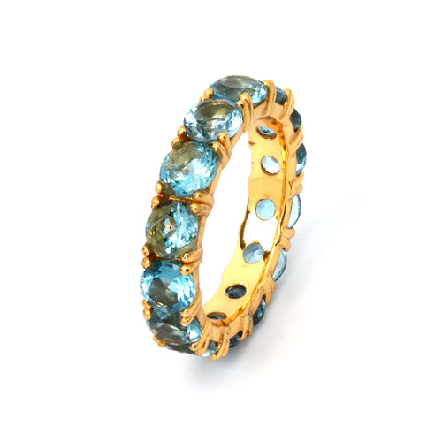 Gold ring with blue topaz gemstones, elegant handmade jewelry design