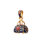 Vintage purse pendant featuring a natural ruby and blue enamel details