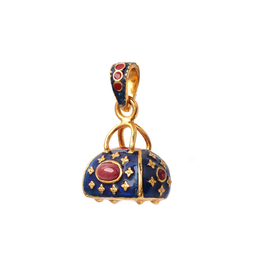 Vintage purse pendant featuring a natural ruby and blue enamel details
