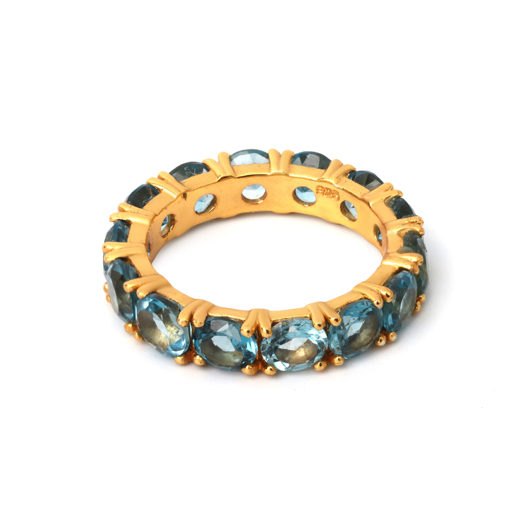 Gold plated blue topaz eternity ring in 925 sterling silver