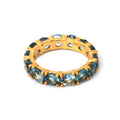 Gold plated blue topaz eternity ring in 925 sterling silver