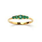 Gold ring with five emerald gemstones, elegant and handcrafted design