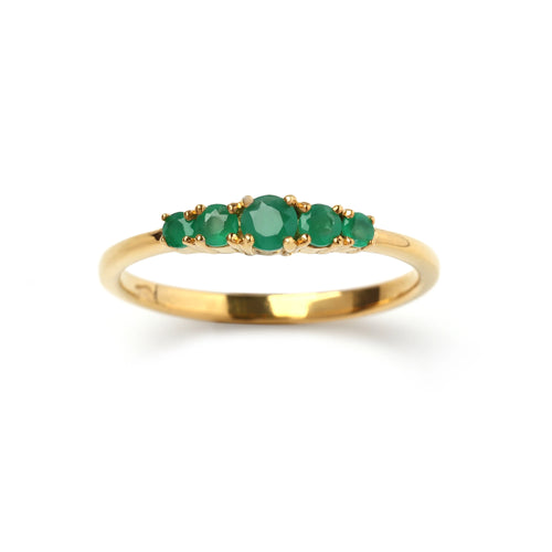 Gold ring with five emerald gemstones, elegant and handcrafted design