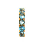 Blue topaz gemstone ring with gold-tone setting, elegant stacking band for women's jewelry collection