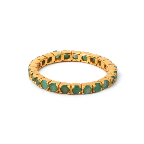 Gold ring with green gemstones, elegant and timeless design