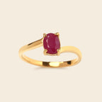 Gold ring with oval ruby gemstone, elegant minimalist design