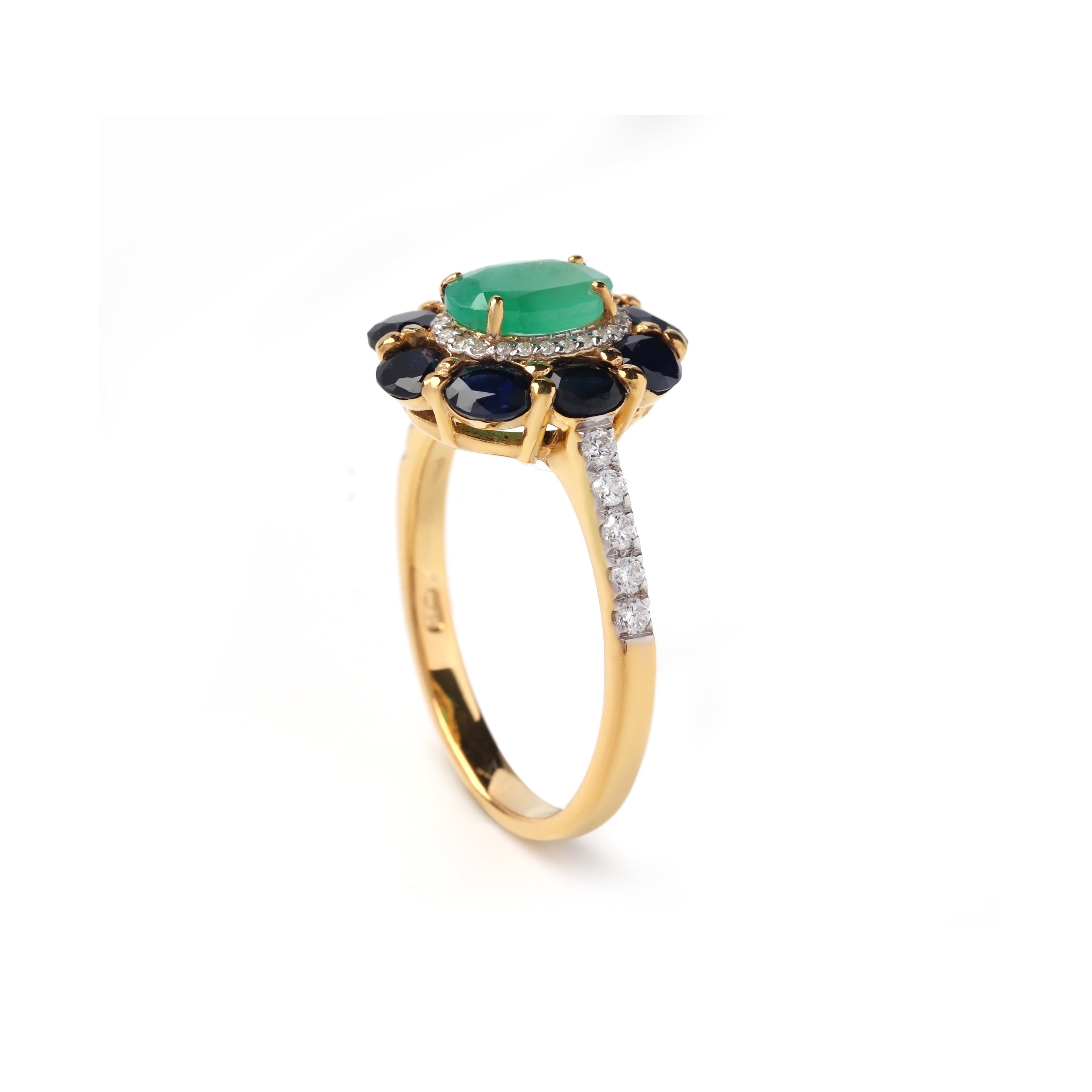 Side view emerald ring showing sapphire accents and pavé band in 925 sterling silver