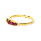 Gold ring with five vibrant red gemstones, elegant stacking design