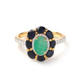 Close-up of emerald sapphire cluster ring in 925 sterling silver with gold finish by Jewelry by Crimson