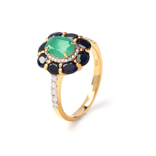 Side view emerald ring showing sapphire accents and pavé band in 925 sterling silver