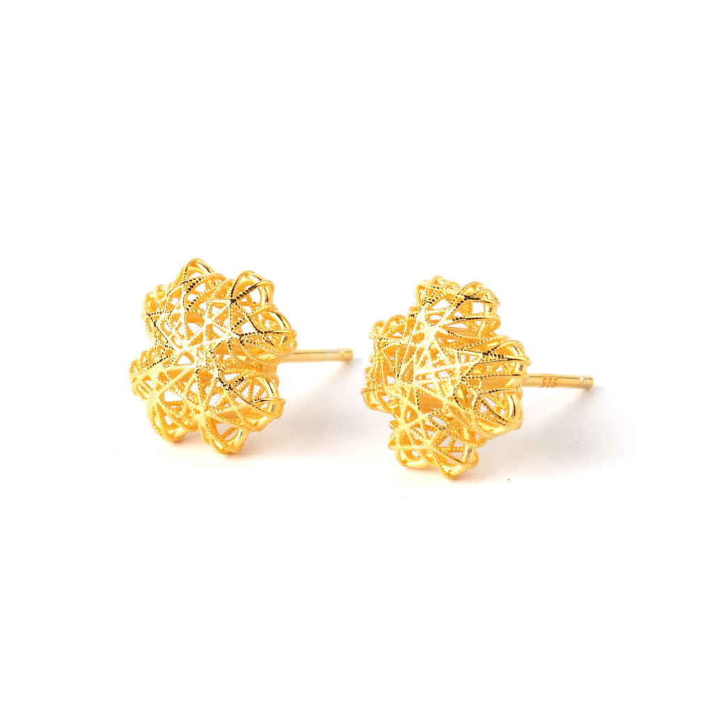 Close-up of gold floral lattice 925 sterling silver stud earrings with mesh texture by Jewelry by Crimson