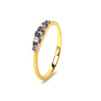 Gold ring with five blue gemstones, elegant and timeless design