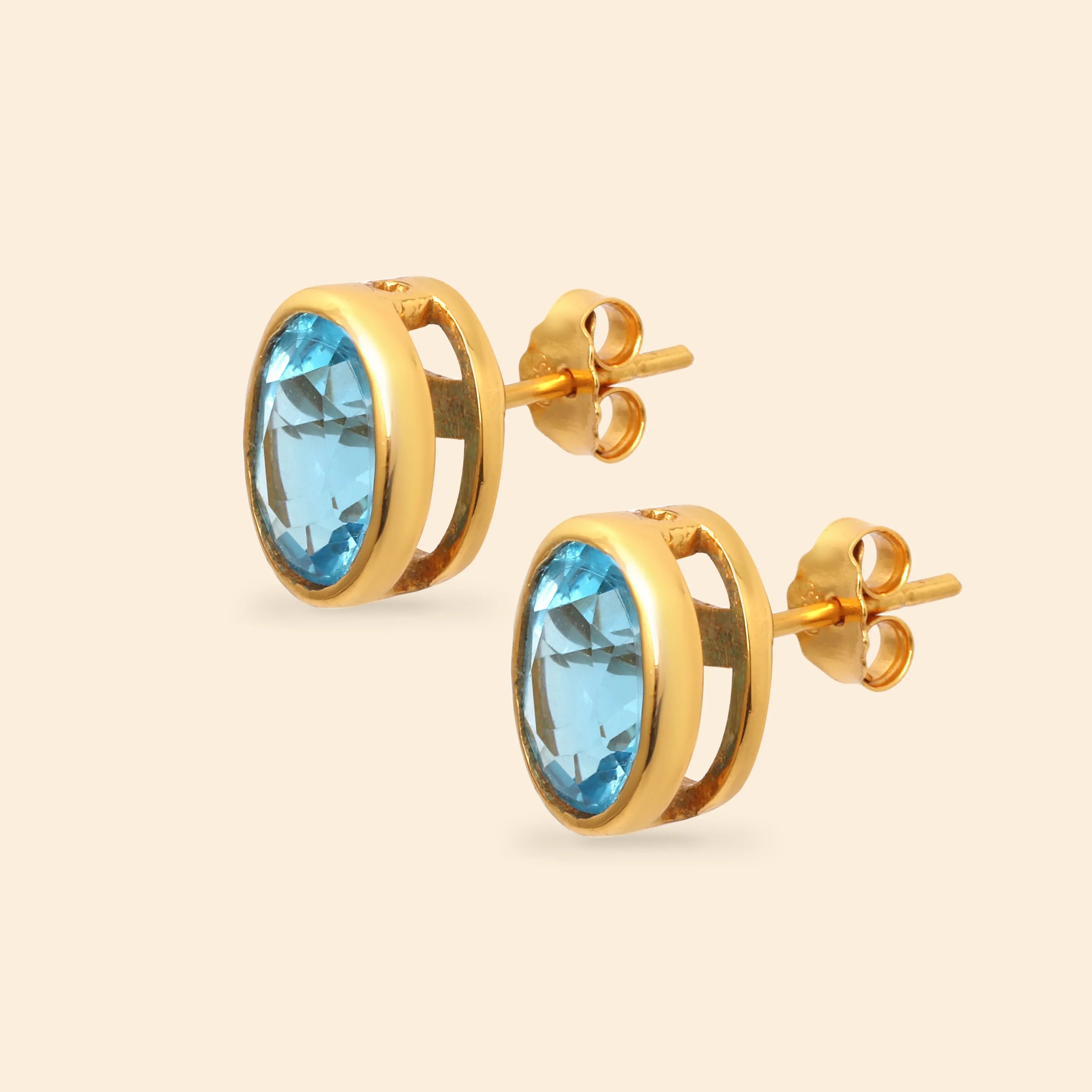 Elegant blue topaz oval stud earrings with gold plated finish