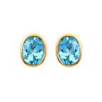 Oval blue topaz stud earrings in gold setting, handcrafted gemstone jewelry