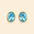 Oval blue topaz stud earrings in 14K gold plated 925 sterling silver