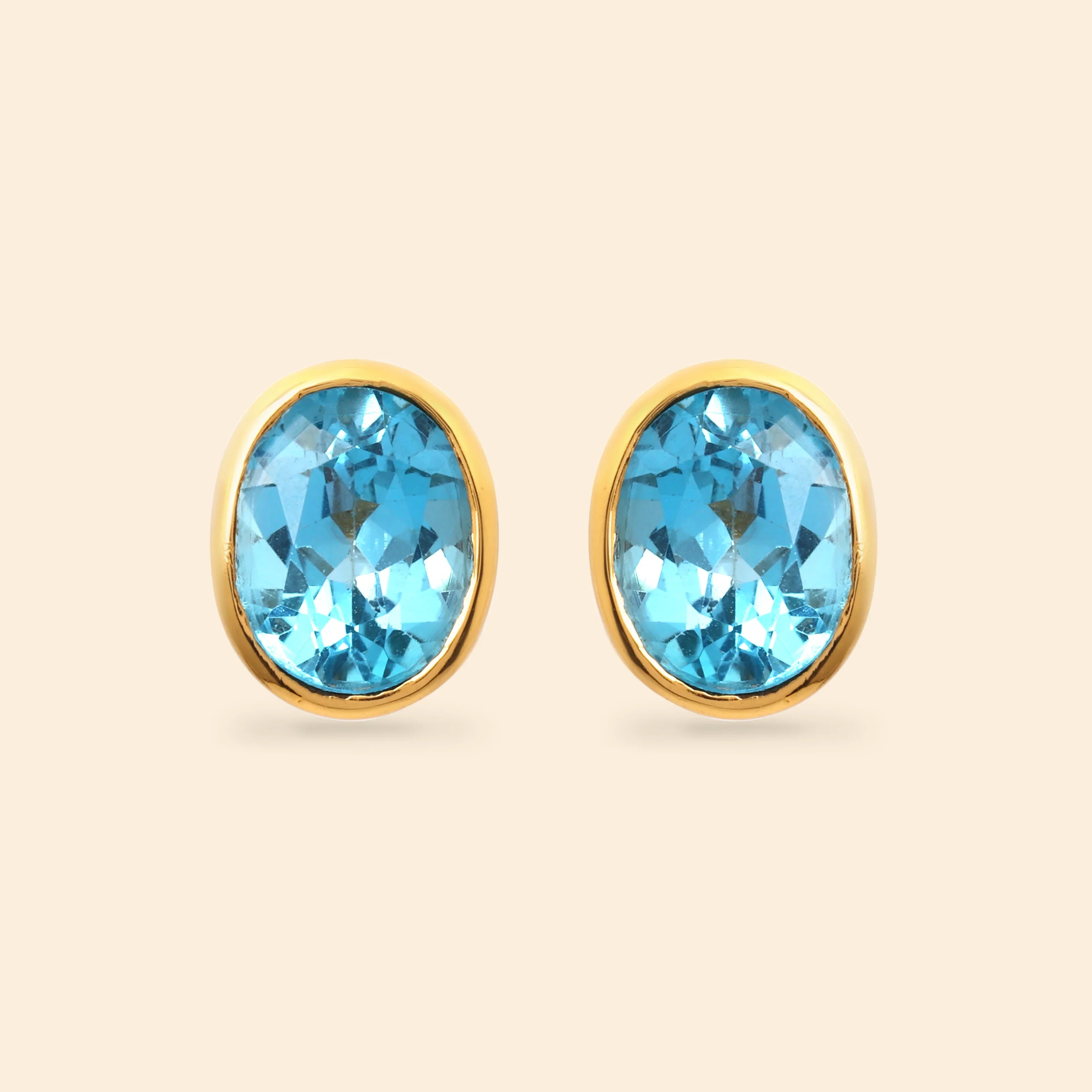 Oval blue topaz stud earrings in 14K gold plated 925 sterling silver