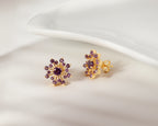 Purple amethyst snowflake earrings in gold — side view