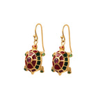 Artisan turtle drop earrings featuring ruby gemstones and sterling silver craftsmanship