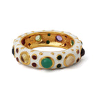 White enamel bangle with gold accents and colorful gemstones, elegant statement jewelry piece