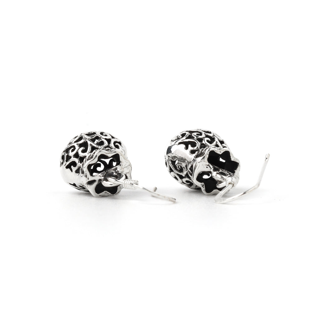 Elegant filigree dangle earrings with polished silver finish