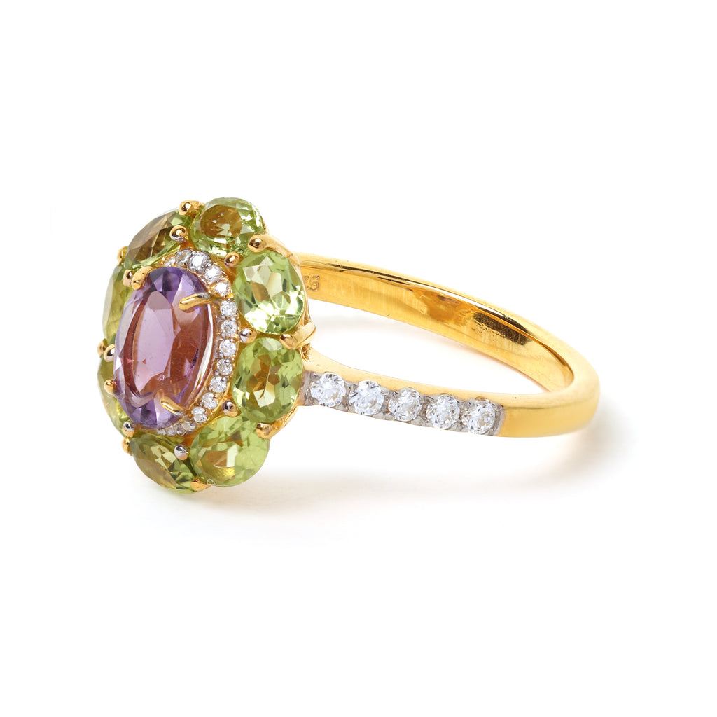 Floral gemstone ring featuring oval amethyst and peridot accents