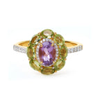 Elegant gold ring with oval amethyst, peridot, and diamond accents, handcrafted gemstone jewelry