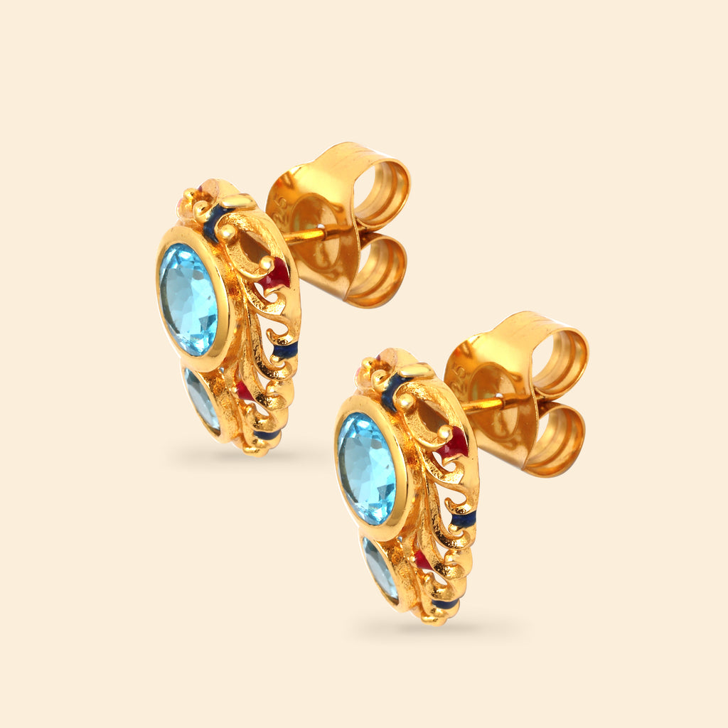 Ornate blue topaz earrings in polished sterling silver