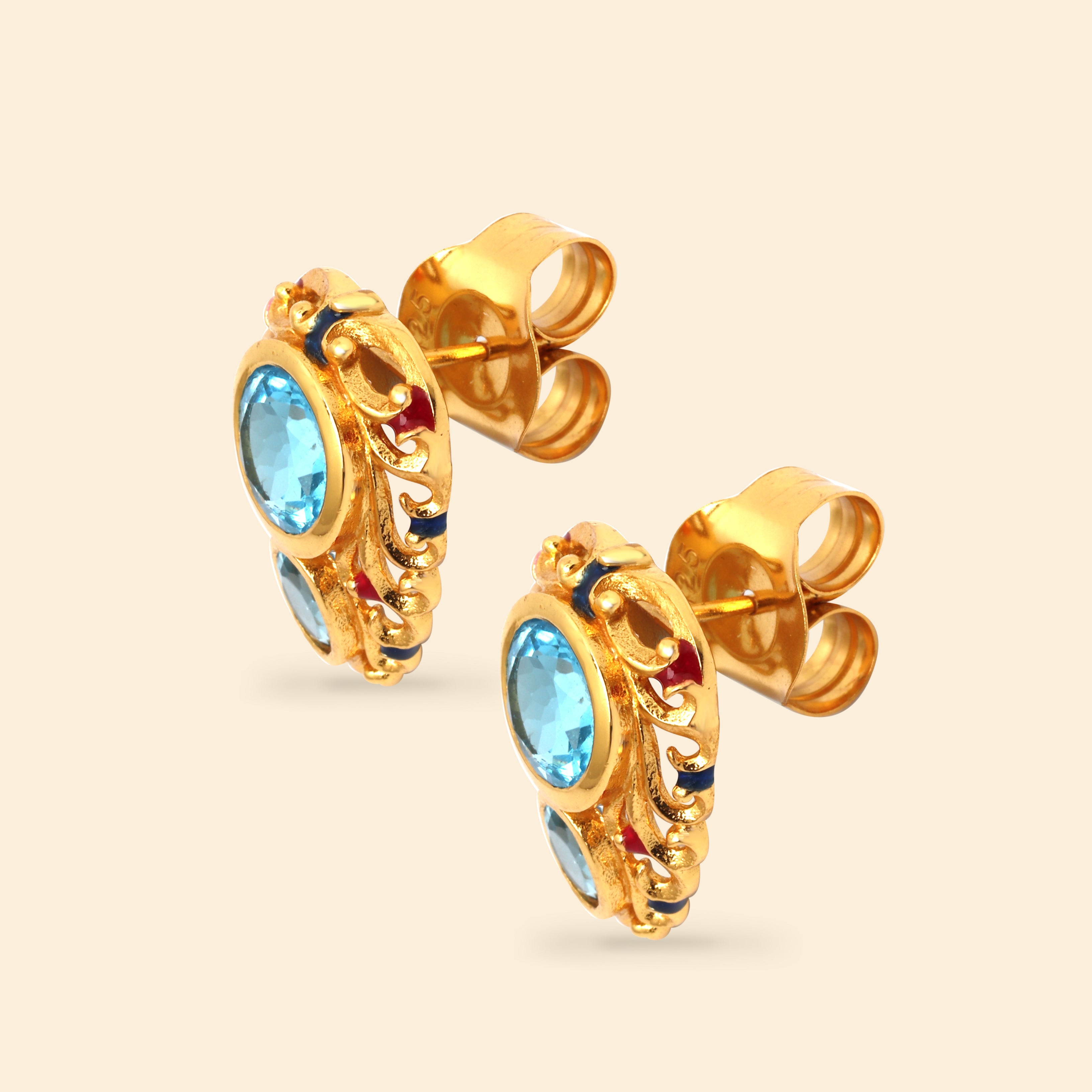 Ornate blue topaz earrings in polished sterling silver