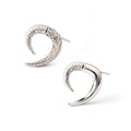 Close-up of 925 sterling silver crescent stud earrings with pavé detailing by Jewelry by Crimson