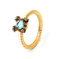 Gold rope ring with blue topaz and sapphire floral accents, handcrafted gemstone jewelry