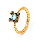 Gold rope ring with blue topaz and sapphire floral accents, handcrafted gemstone jewelry